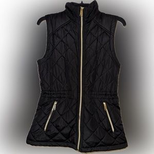 Black vest with gold accents